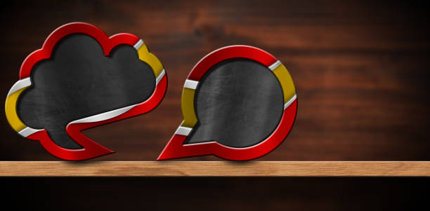 istock Two Empty Speech Bubbles with Spanish Flag on a Wooden Shelf 1511275387