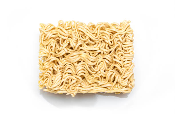 istock Uncooked Instant Noodles on White Plate 1511278359