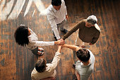 Teamwork, above and people hands stacked for support, collaboration and project mission for business startup. Group circle, women and men, together hand sign and community goals or career solidarity