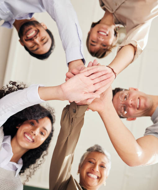 istock Teamwork, people portrait and hands together in support, collaboration or team building mission from below. Group, circle or business women and men, stacked hand sign and happy goals with diversity 1511282921