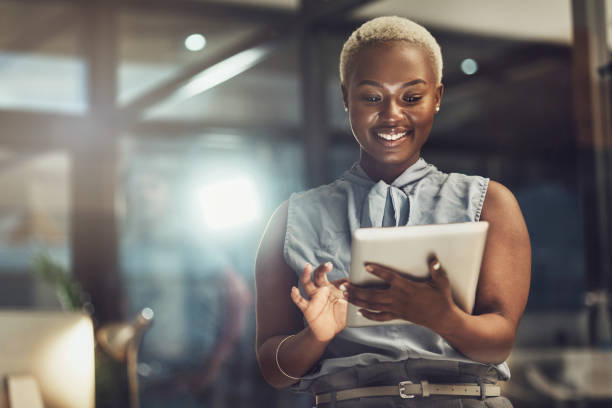 Smile, tablet and search with black woman in office for technology, corporate and communication. Social media, connection and internet with female and online for networking, email and website stock photo