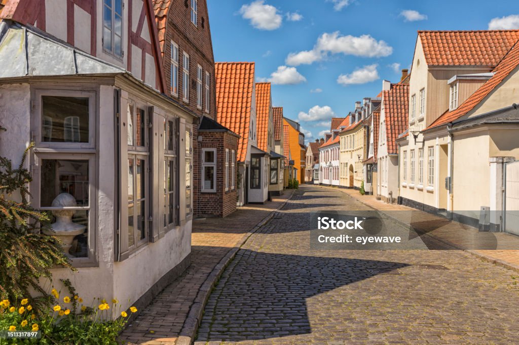 Cobbled street at the old town of Aabenraa, Denmark Old houses on cobbled street at the old town of Aabenraa, Denmark Building Exterior Stock Photo