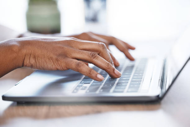 istock Hands, laptop and typing in research, email or business proposal for schedule planning on office desk. Hand of person working on computer for communication, networking or social media at workplace 1511325435
