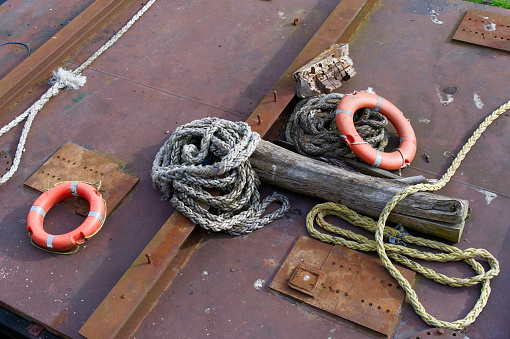 Red buoy life safety ring on pontoon and safety rope UK