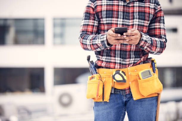 istock Phone, worker hands or construction man typing internet, online web search and message maintenance industry contact. Connection, smartphone mockup or urban person, contractor or handyman texting user 1511329767