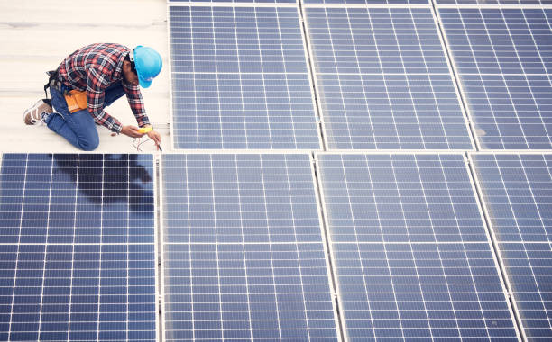 istock Black man, solar panel installation and renewable energy, sustainability and eco friendly technology. Maintenance, male engineer and infrastructure, electricity and top view with energy saving 1511329839