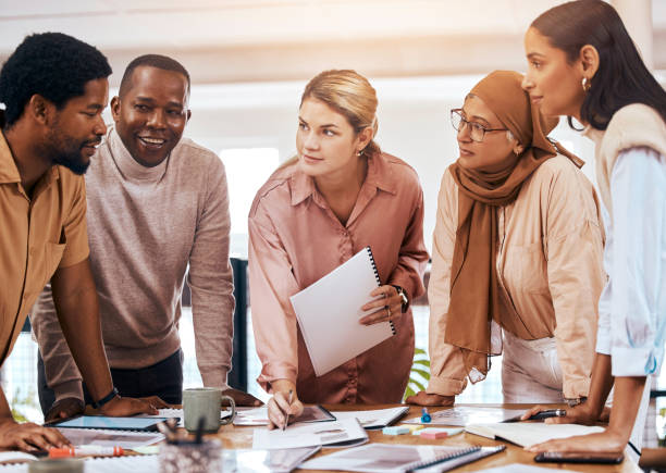 istock Planning, teamwork and business people collaboration, talking ideas and brainstorming with documents for meeting. Diversity employees, women and men agenda, strategy and listening to startup manager 1511332358