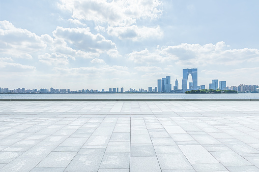 Empty square road and city skyline in Suzhou, China