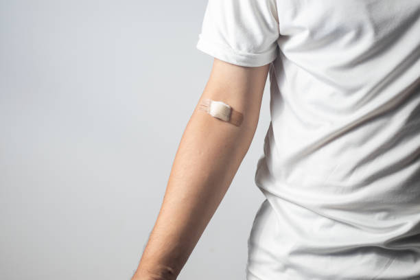 istock Male arm after venipuncture for annual check-up 1511365390