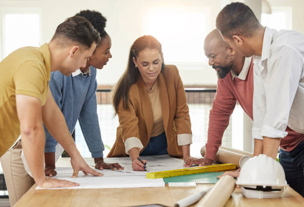 istock Teamwork, architecture and business people in meeting for planning, discussion and engineering design. Collaboration, construction and men and women talking with blueprint, floor plan and documents 1511396670