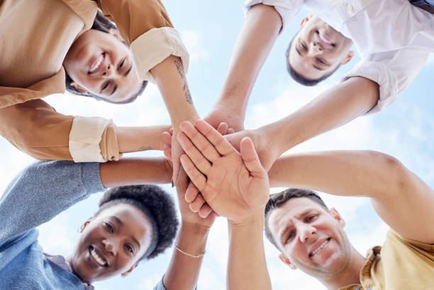 istock Below circle, hand stack and business people with support, smile and portrait for goal motivation. Men, women and hands together for solidarity, diversity and happiness with team building at job 1511397099