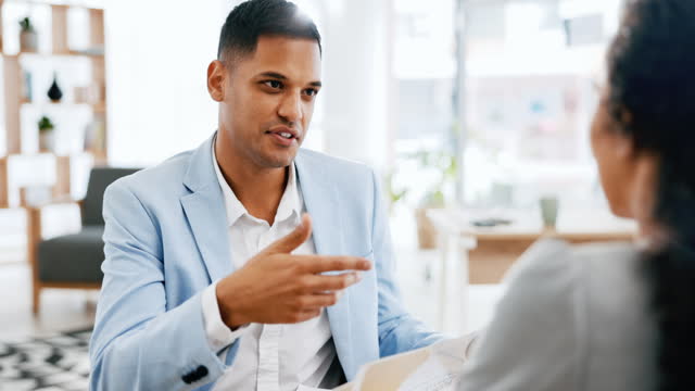 Business people, interview and meeting in hiring, resume CV or recruitment for job opportunity at office. Businessman talking to candidate, new recruit or intern for onboarding portfolio at workplace