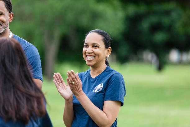 istock Mature female claps and celebrates while hearing about their successful volunteering day 1511406729