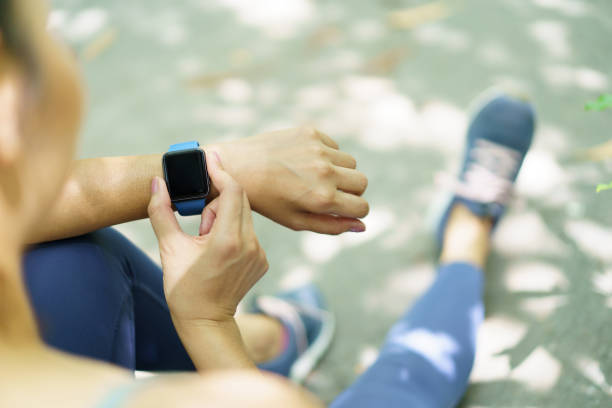 istock Woman using fitness tracker or smartwatch in exercise. 1511416664