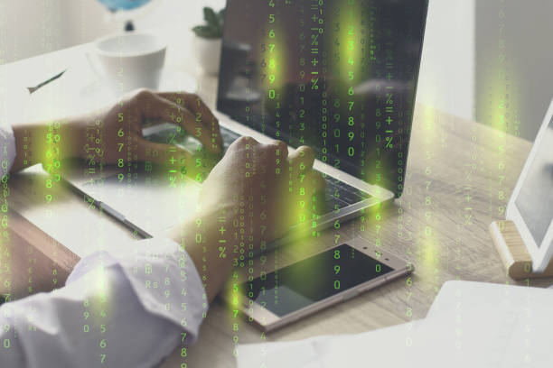 istock Close up hand typing on laptop with coding hologram 1511431012