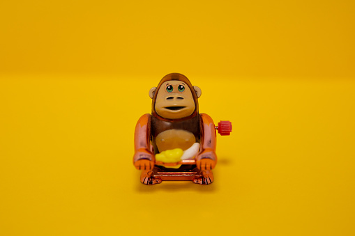 Gorila toy on yellow background