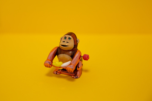 Gorilla toy on yellow background