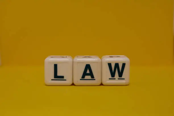 Law letter blocks on yellow background