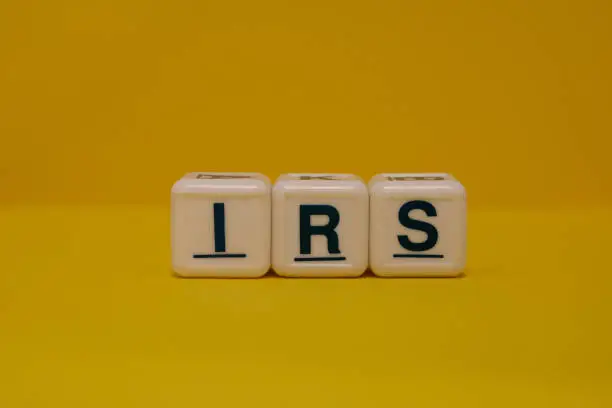 IRS letter blocks on yellow background