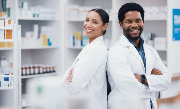 Pharmacists, people and arms crossed in portrait, medicine trust or about us healthcare in medical drugstore collaboration. Smile, happy and confident pharmacy teamwork in retail consulting or help stock photo