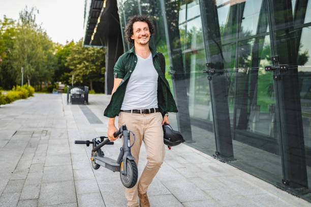 istock Man carrying his folded electric scooter in one hand 1511481102