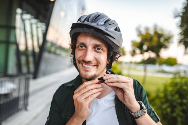 istock Portrait of a man putting on protective helmet before leaving work on his e-scooter 1511481684