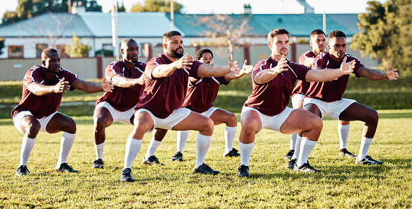 Rugby, haka or team with unity, support or motivation in a battle cry, war dance or challenge with solidarity. Performance, fitness group or athletes dancing before a game or match in sports stadium