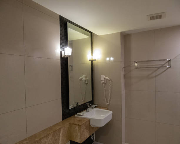 istock bathroom, haven of tranquility, embraced me with its pristine tiles and soft ambient lighting.The gleaming fixtures and immaculate porcelain sink exuded elegance, inviting me to indulge in refreshing 1511532750