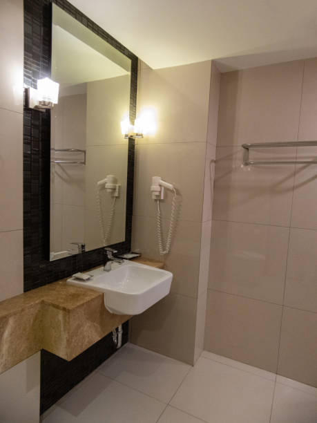 istock bathroom, haven of tranquility, embraced me with its pristine tiles and soft ambient lighting.The gleaming fixtures and immaculate porcelain sink exuded elegance, inviting me to indulge in refreshing 1511535409