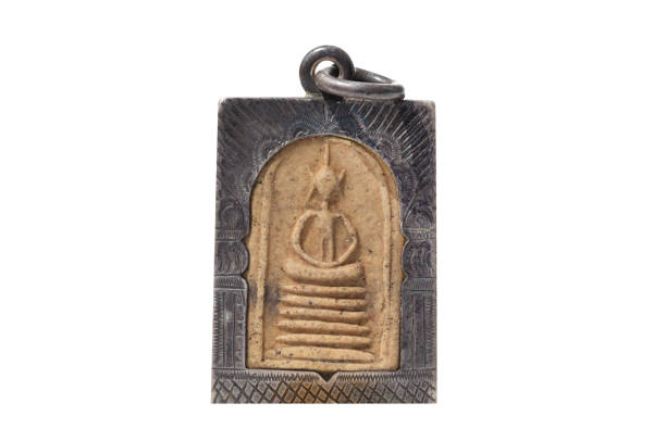 istock Amulets, Macro Thai buddha amulet isolated on white background. 1511539325