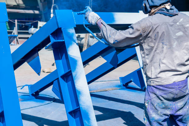 istock The painter uses a spray gun to paint a steel structure before transportation to the assembly yard. 1511542516