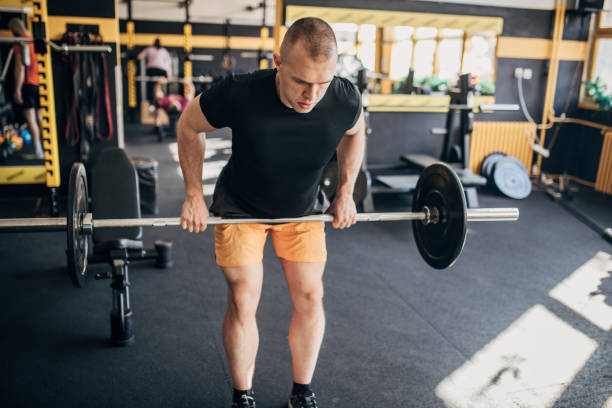 istock Weightlifting practice in gym 1511547977
