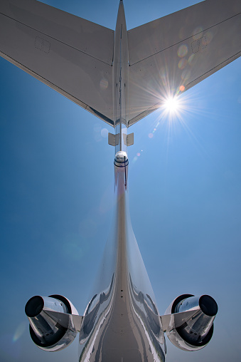 Detail of a corporate jet tail and top mounted engines.