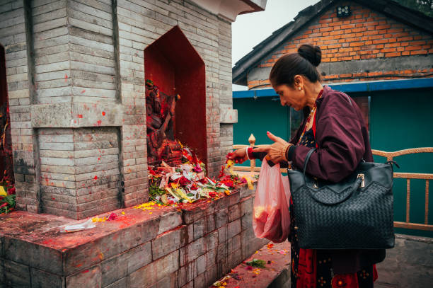 Pokhara, Nepal - Apr 15, 2023: Nepali people gather at Bindhyabasini Temple in Pokhara to celebrate Navavarsha (Nepali New Year Event) and perform Puja rituals, offering prayers to their gods.