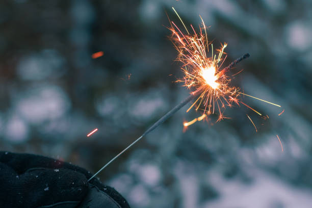 istock Burning Sparklers in a Hand Outdoors 1511577919