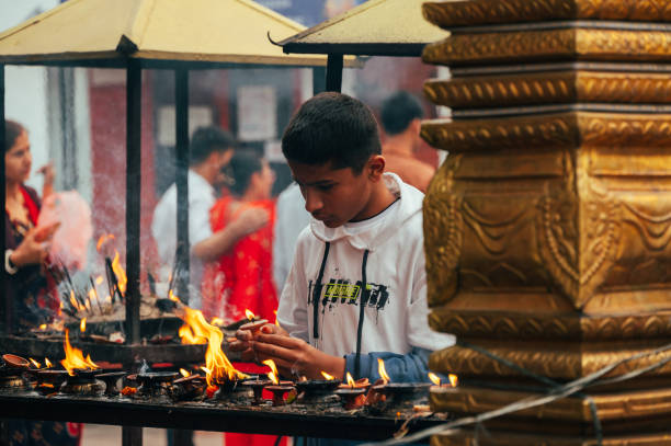 Pokhara, Nepal - Apr 15, 2023: Nepali people gather at Bindhyabasini Temple in Pokhara to celebrate Navavarsha (Nepali New Year Event) and perform Puja rituals, offering prayers to their gods.