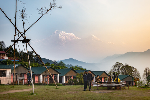 Pokhara, Nepal: Apr 14,2023 - A landscape around the Australian Camp, a famous trekking route located in Annapurna Mountain Range, with tourists and trekkers enjoying their morning activities.