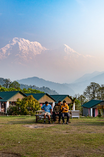Pokhara, Nepal: Apr 14,2023 - A landscape around the Australian Camp, a famous trekking route located in Annapurna Mountain Range, with tourists and trekkers enjoying their morning activities.