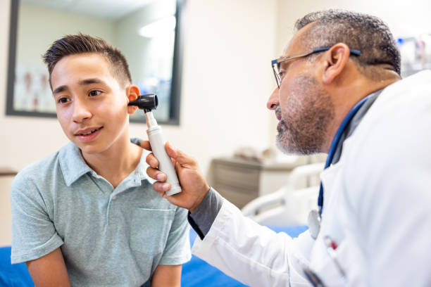 Doctor exam for a 12 year old boy stock photo
