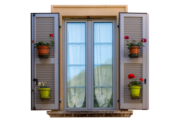istock traditional windows with grey shutters, flower pot, europe 1511591693