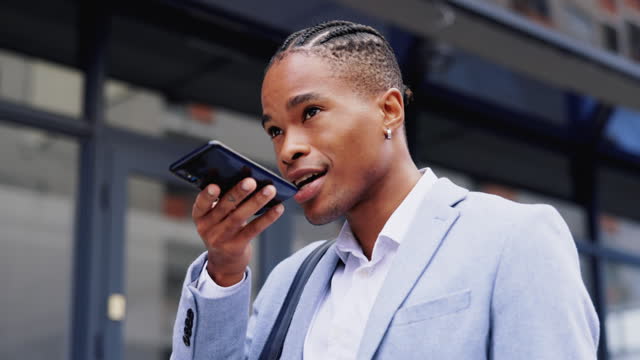 Black man, business phone call and speaker in city for assistant, chat and networking in metro street. African businessman, smartphone and loudspeaker for audio, voice notes or memo on road in cbd