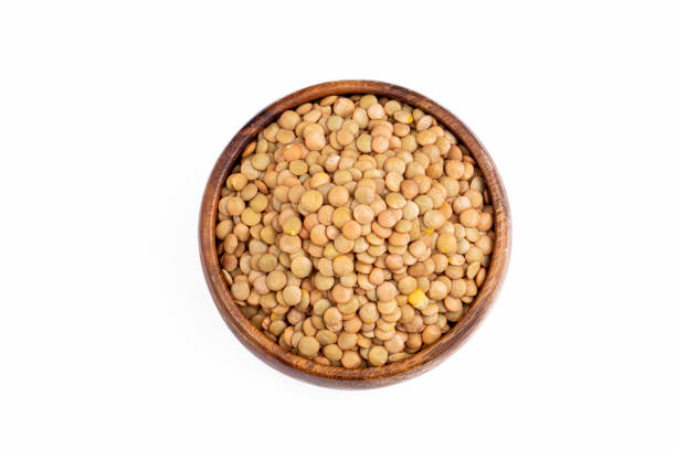 istock Dried green lentil on the white background 1511605357