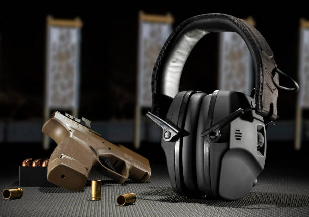istock Hearing protection with ammo and a pistol 1511611406