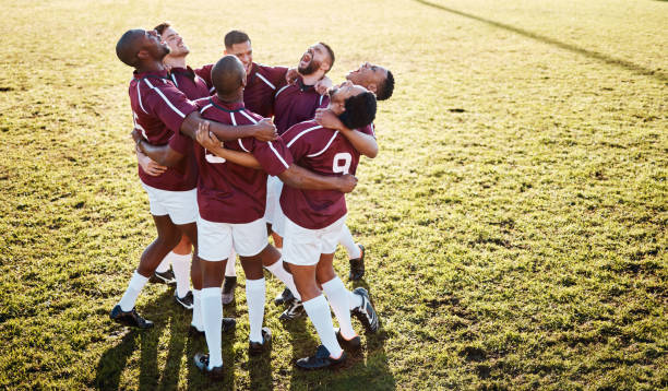 istock Fitness, field and group in a huddle with motivation, strategy and coordination after training. Sports, collaboration and team of male athletes in unity before a game or match by a grass stadium. 1511615669