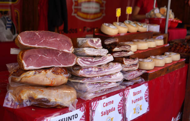 traditional presunto ham sold at farmers market stall - for sale industry farmers market market stall imagens e fotografias de stock