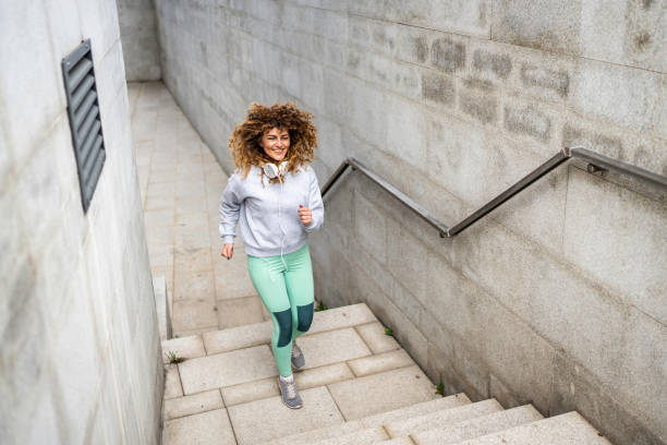 istock Athletic woman running up stairs during cardio - interval training 1511655637