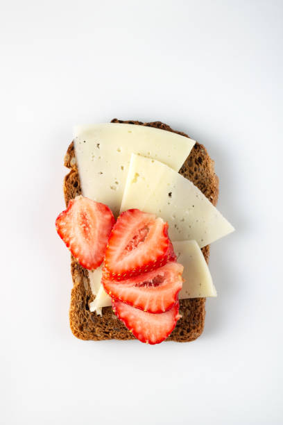 istock bread with cheese and strawberry slices, isolate on white background 1511696871
