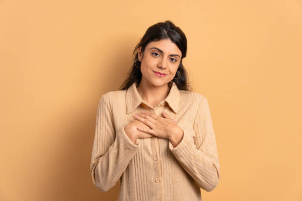 istock woman hands over heart, chest 1511704964