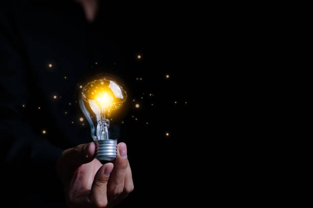 istock Businessman an holding illuminated light bulb with brain inside. New idea innovation concept, Business Bright idea concept, Creative and innovation inspiration, New idea business start up, 1511736374