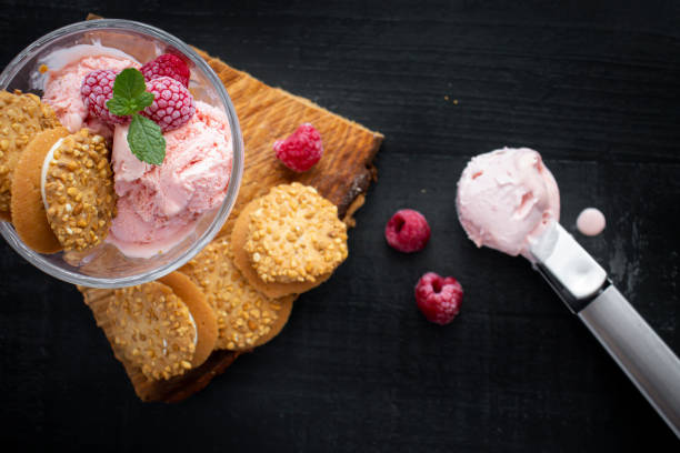 istock Raspberry ice cream in a bowl. on a dark background. Sweet dessert 1511739138